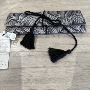 White House Black Market jewelry roll Lunar Snake Design with a tassel NWT